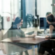 Business professionals discussing IT strategies in an office, showcasing the benefits of managed IT solutions in Dallas for seamless operations and communication.
